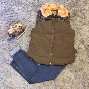 Olive green fur collared vest.